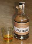 apple brandy bottle and glass